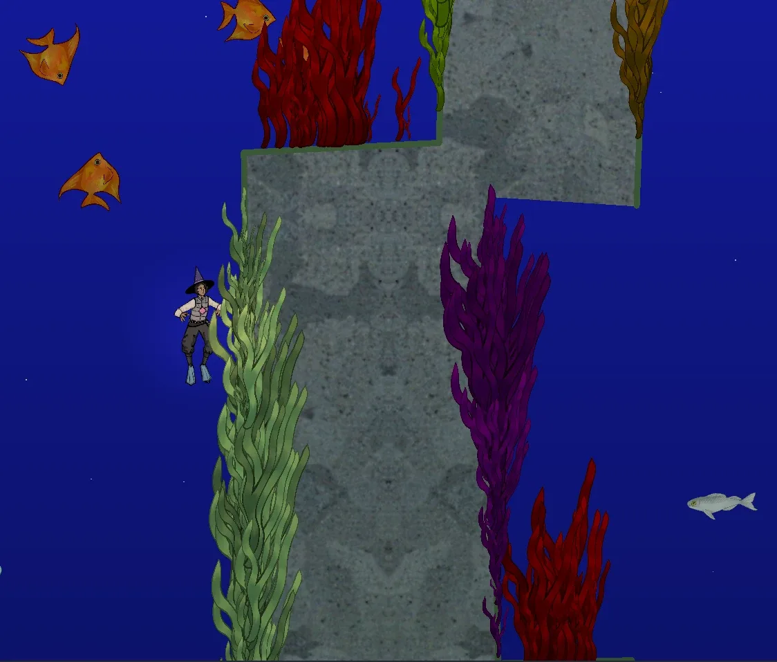 The diver swimming beside a rock pillar covered in green, purple and red seagrass, with orange fish